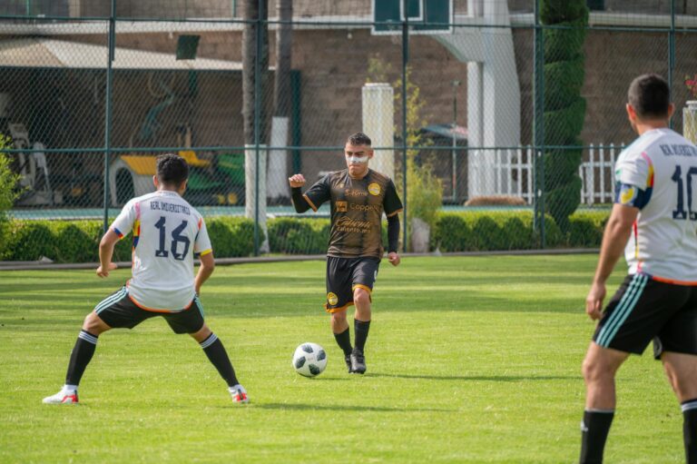 Intense soccer match with players in action in Texcoco, México.