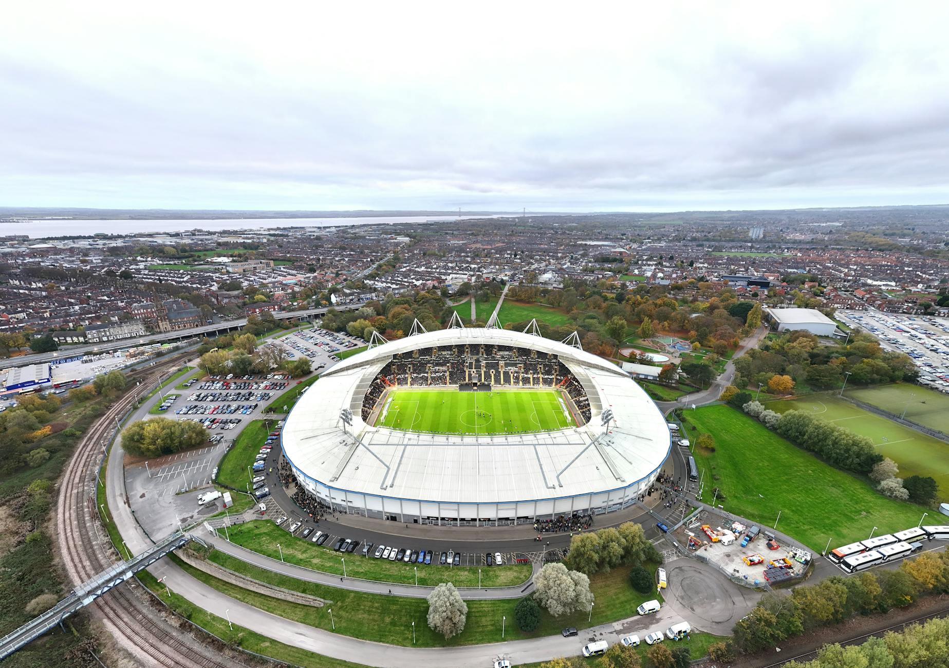 Aerial view of MKM Stadium in Hull, England, bustling with fans on match day.