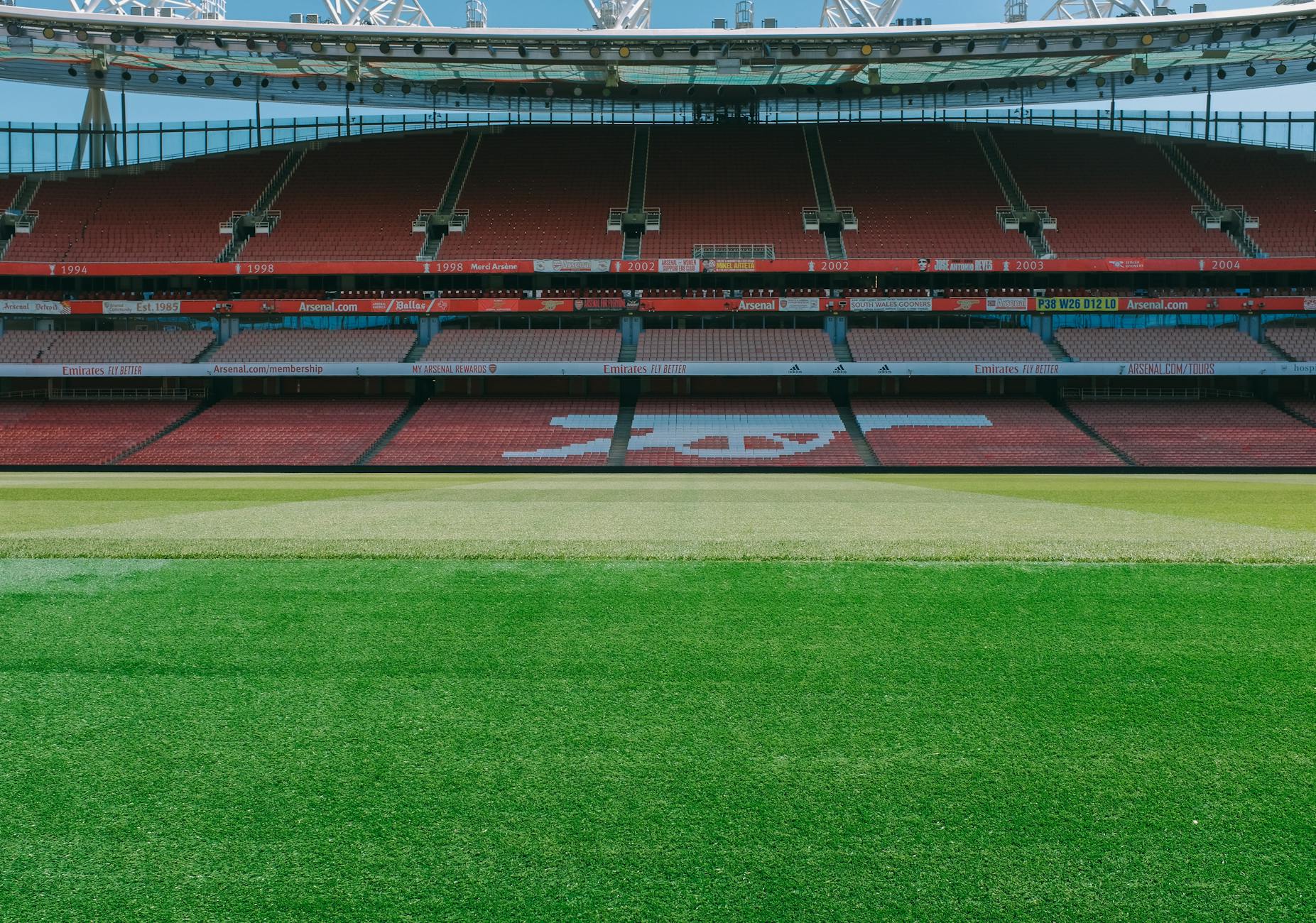 A view of the empty stands and football pitch at Emirates Stadium, London.
