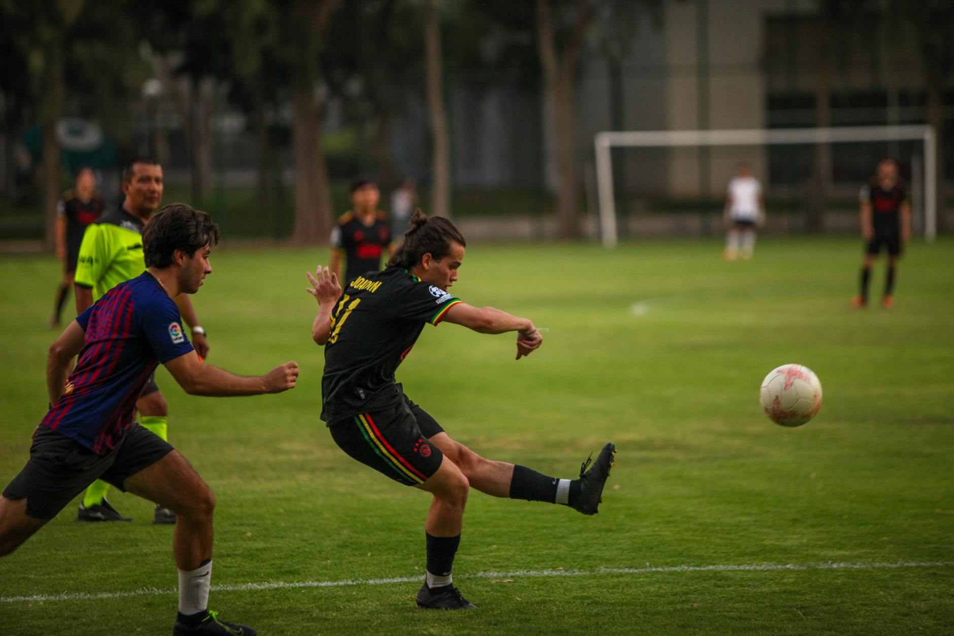 Players in action during a competitive outdoor soccer match.