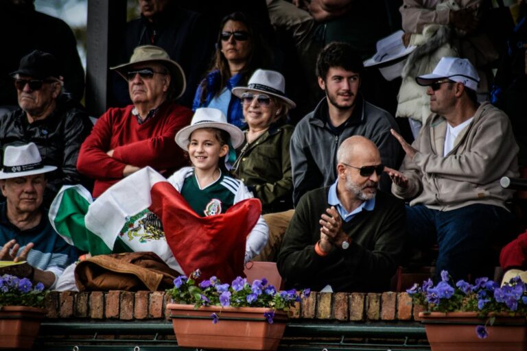 A diverse crowd enjoying a lively outdoor celebration in Montevideo, Uruguay.