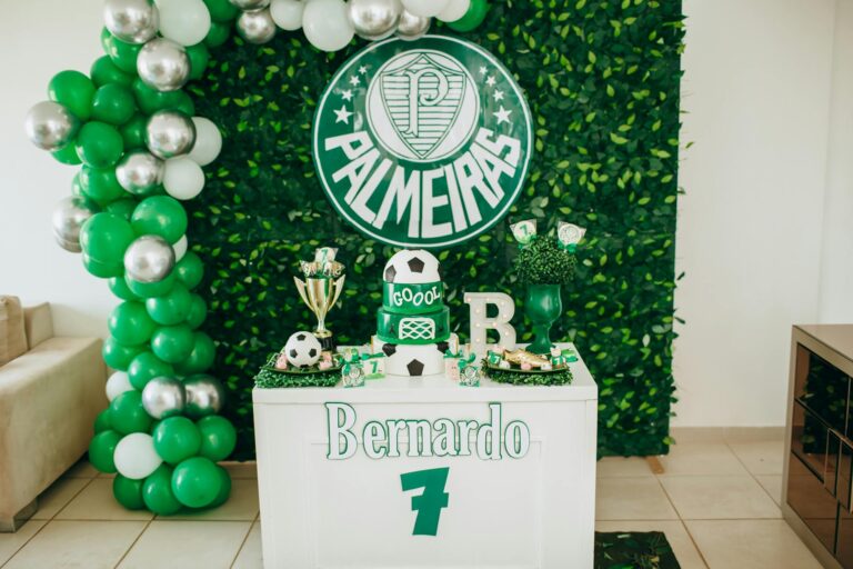 Vibrant football-themed birthday party setup with Palmeiras decorations and cake.