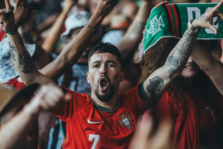 A vibrant scene of passionate sports fans celebrating in a lively atmosphere.