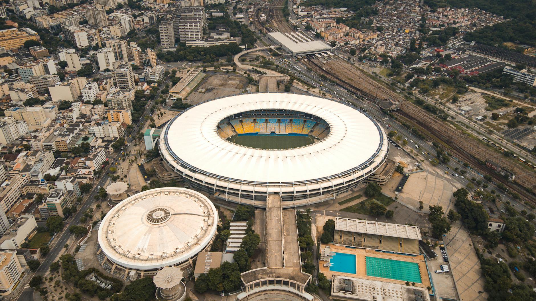 Drone shot of Maracanã Stadium and surrounding cityscape in Rio de Janeiro, Brazil.
