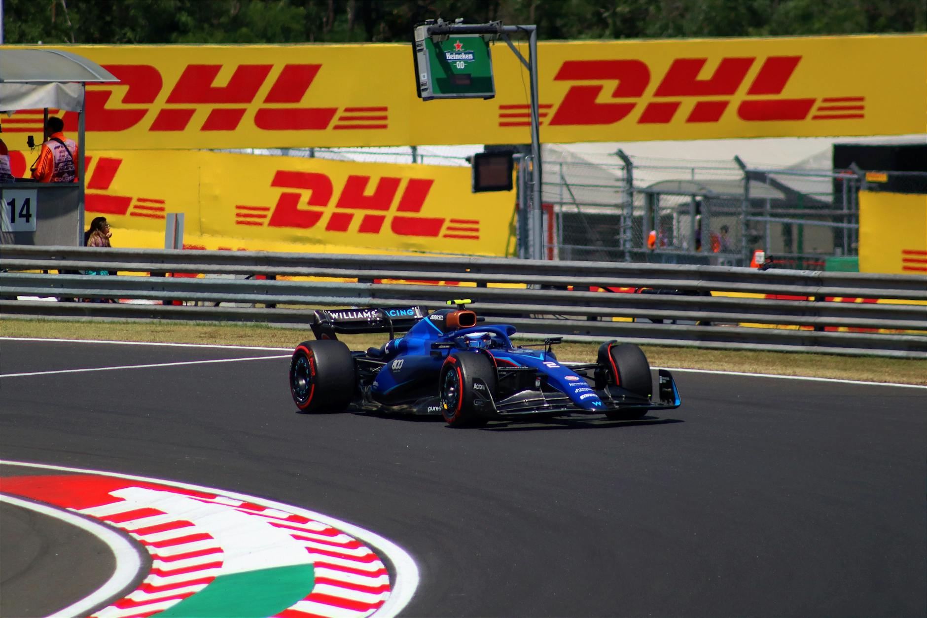 High-speed Formula 1 car on the track during a sunny day at Hungaroring, Hungary.