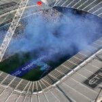 Aerial shot of Etihad Stadium during a soccer event in Manchester, UK.