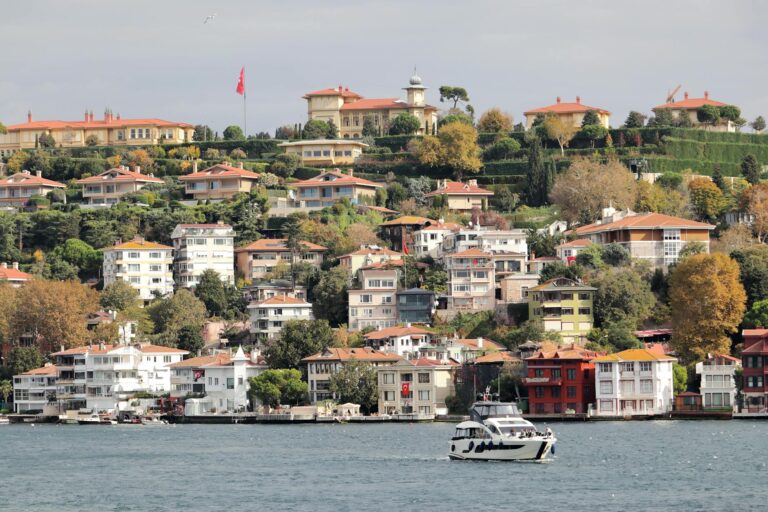 Beautiful hilltop villas overlooking the waters of Istanbul, Turkey with autumn foliage.