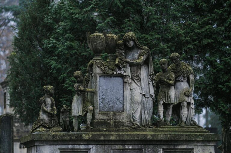 An ancient moss-covered sculpture in Lychakiv Cemetery, Lviv, Ukraine.