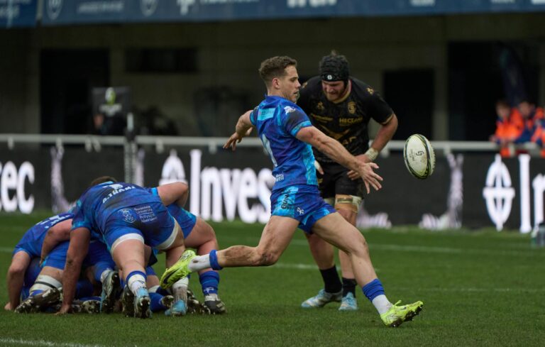 Intense rugby match captured in Montpellier, France, showing players in action on the field.