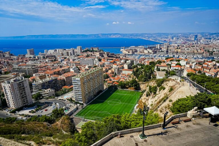 A stunning aerial view of Marseille, France, showcasing the city's skyline and the Mediterranean Sea.