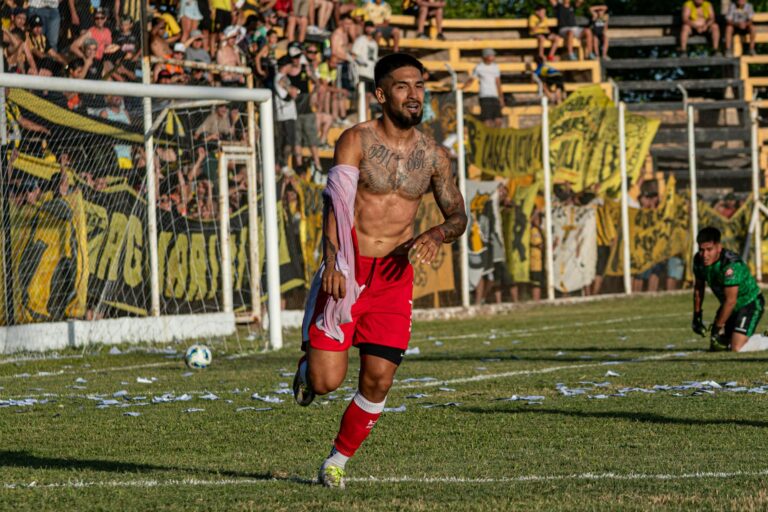 Unforgettable soccer player's celebration in a vibrant outdoor match setting.