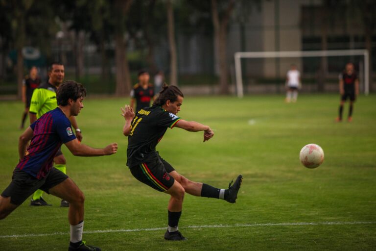 Players in action during a competitive outdoor soccer match.