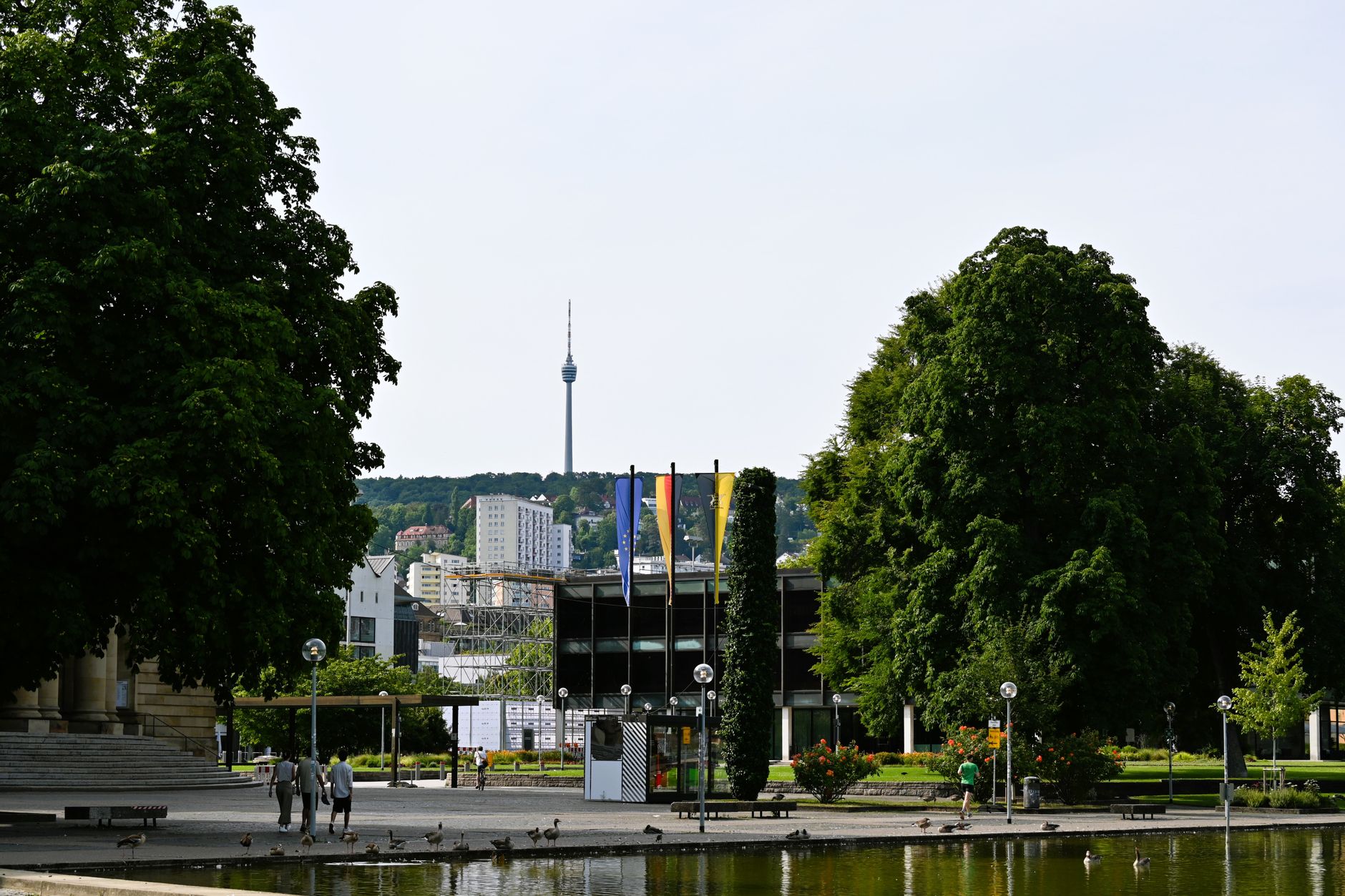 A scenic view of Stuttgart park showcasing greenery and iconic TV tower in the distance.
