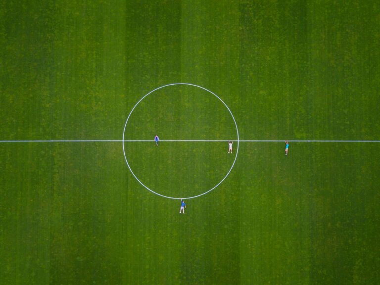 Aerial shot of people on a soccer field in Luzern, Switzerland.