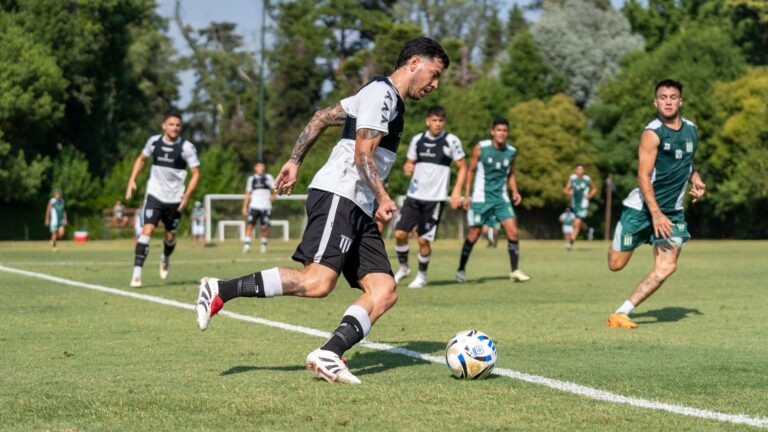 Dynamic action shot of a soccer match with athletes competing outdoors.