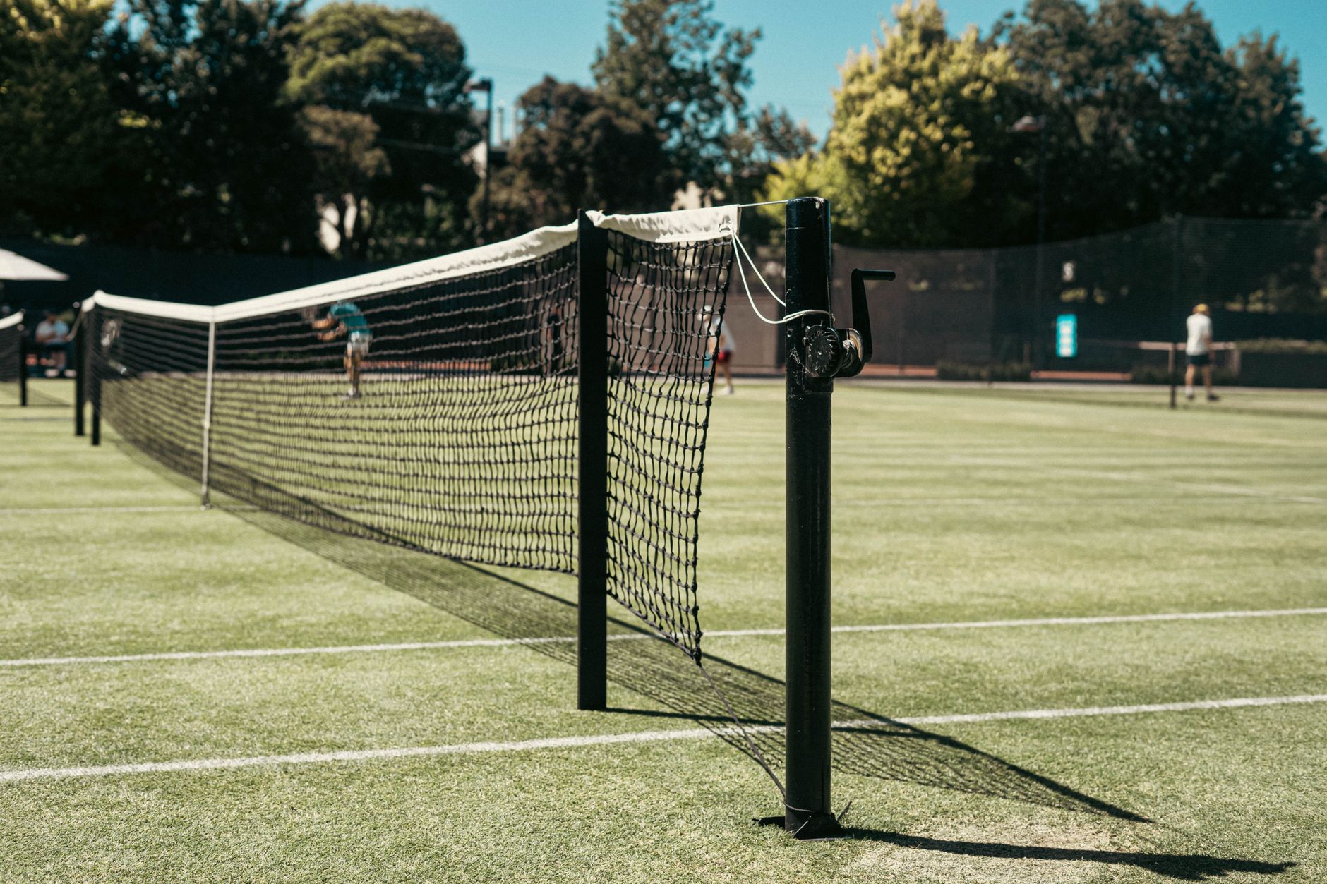 Detailed view of a tennis net on a sunny day at Toorak tennis court in Australia.