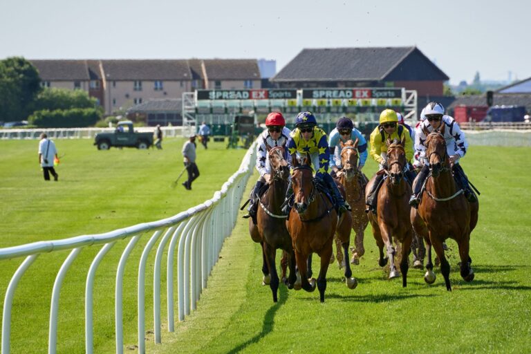 A thrilling scene of horse racing with jockeys competing at Musselburgh Racecourse.