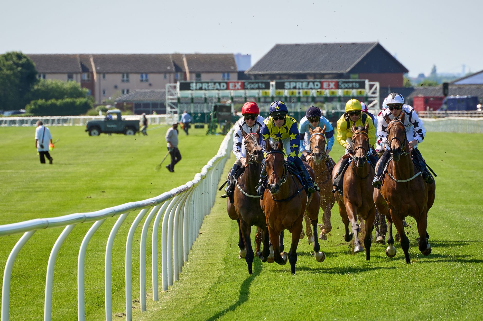 A thrilling scene of horse racing with jockeys competing at Musselburgh Racecourse.
