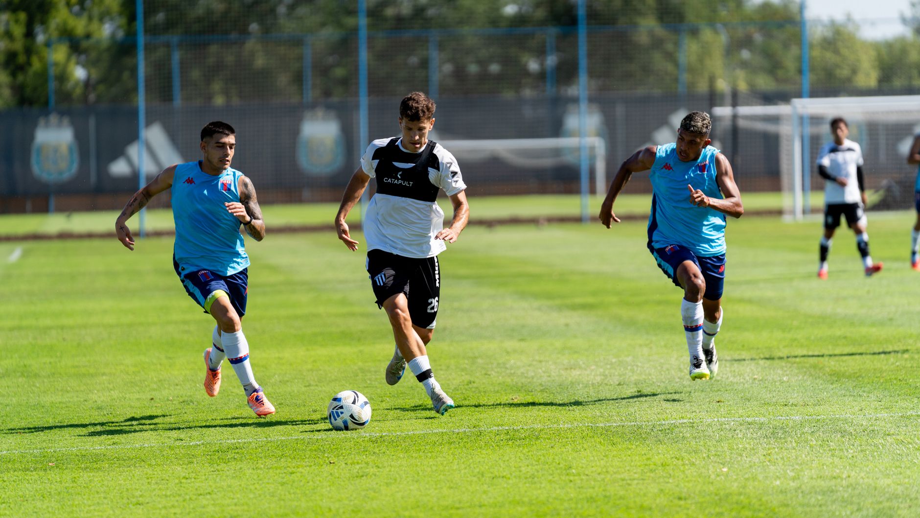 Intense soccer match with players striving for victory on a vibrant green field.