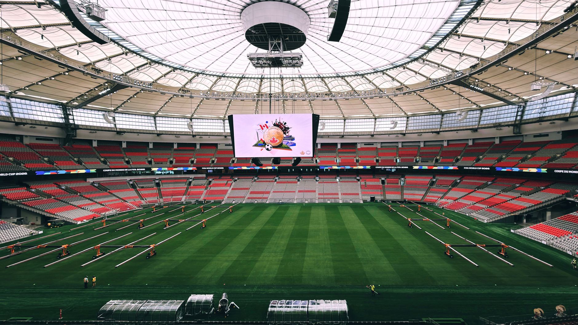 Interior view of BC Place Stadium in Vancouver, showcasing its vast seating and advanced roof structure.