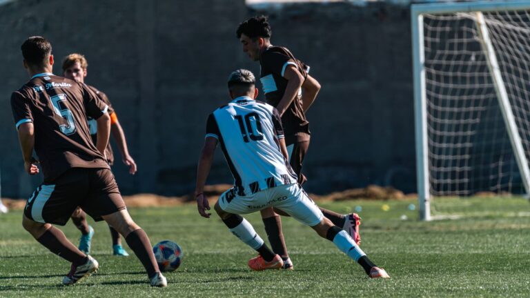 Action-packed soccer game with players competing on a grassy field.