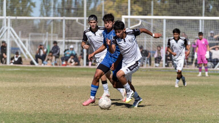 Action-packed youth soccer match with players competing fiercely outdoors.