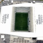 Drone shot capturing the iconic Neo Química Arena stadium in São Paulo, Brazil.