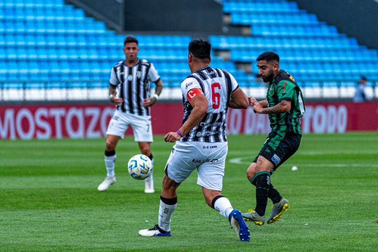 Dynamic soccer match scene with players competing for the ball on a professional field.