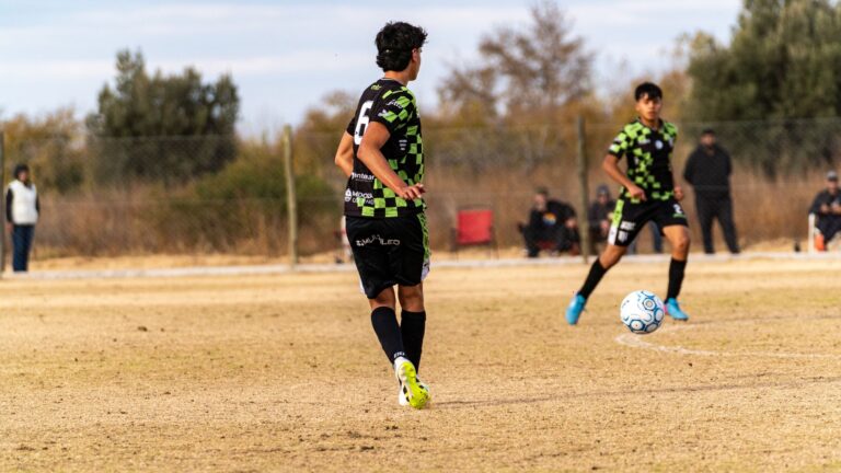Young soccer players in action during a casual outdoor match.