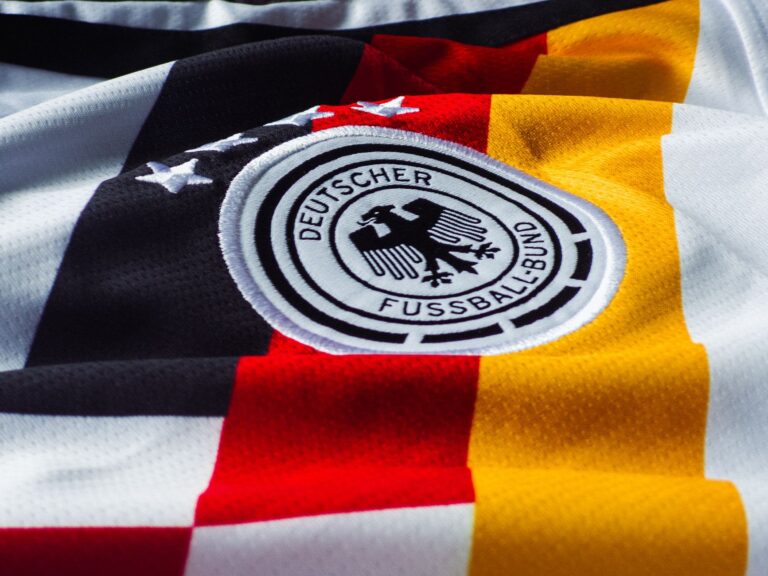 Detailed view of the German national football team jersey with emblem.