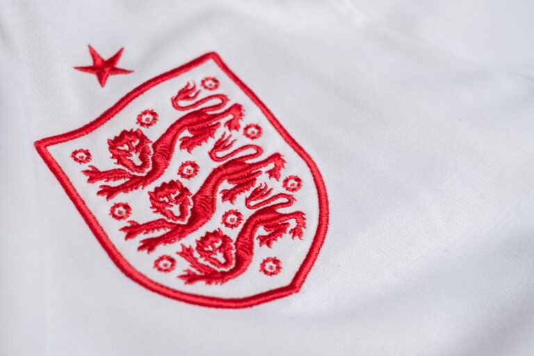 Detailed look at the England national football team's emblem on a jersey.