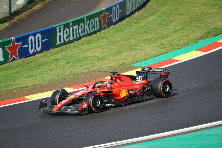 Ferrari Formula 1 car racing on a track during a Grand Prix event.