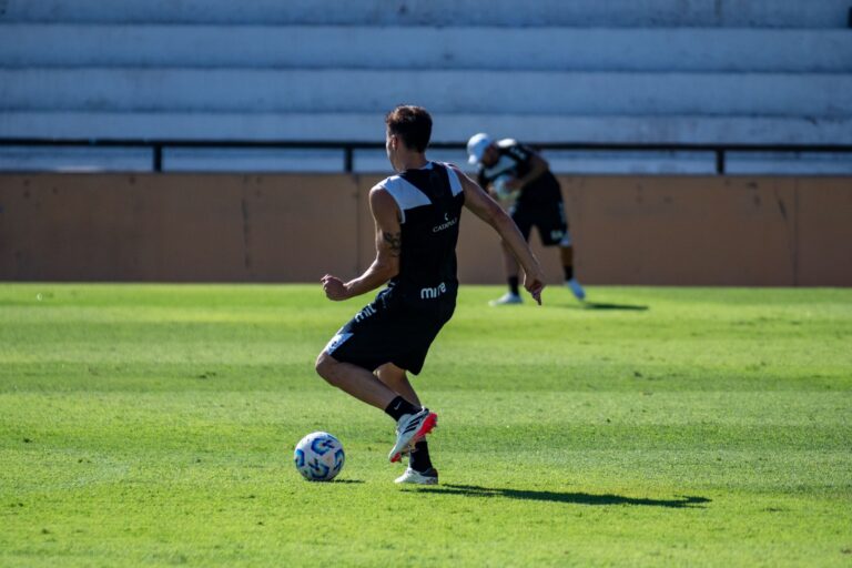 A soccer player training on a sunny day, showcasing agility and skill.