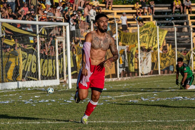 Unforgettable soccer player's celebration in a vibrant outdoor match setting.