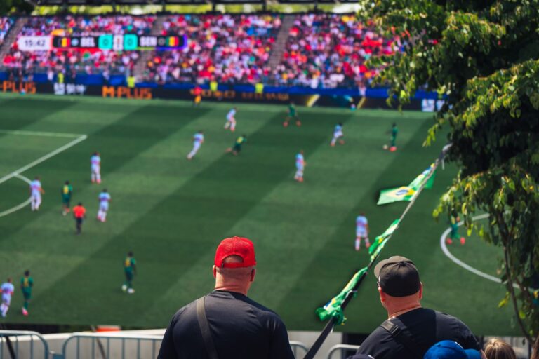 Engaging view of soccer fans enjoying a live match at a stadium in Langford, BC, Canada.