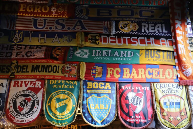 A vibrant array of international soccer fan scarves showcasing various teams.
