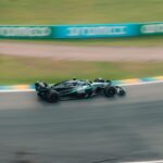 A race car spearing down a track in São Paulo, Brazil, showcasing speed and motion.
