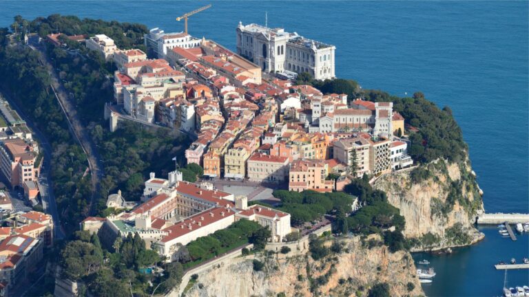 Breathtaking aerial shot of Prince's Palace of Monaco and Mediterranean coast.
