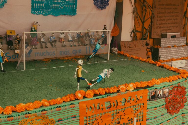 Colorful Day of the Dead miniature soccer display captures Mexican tradition.