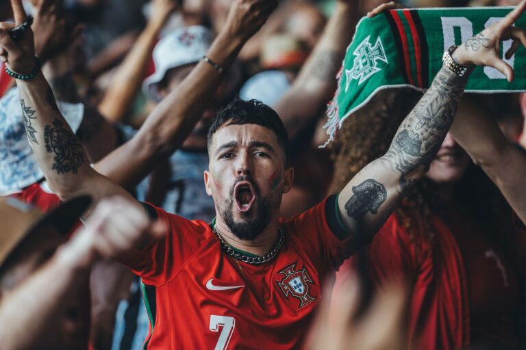 A vibrant scene of passionate sports fans celebrating in a lively atmosphere.