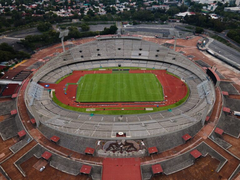 A breathtaking aerial view of Estadio Olímpico Universitario in Mexico City, showcasing its grand architecture.