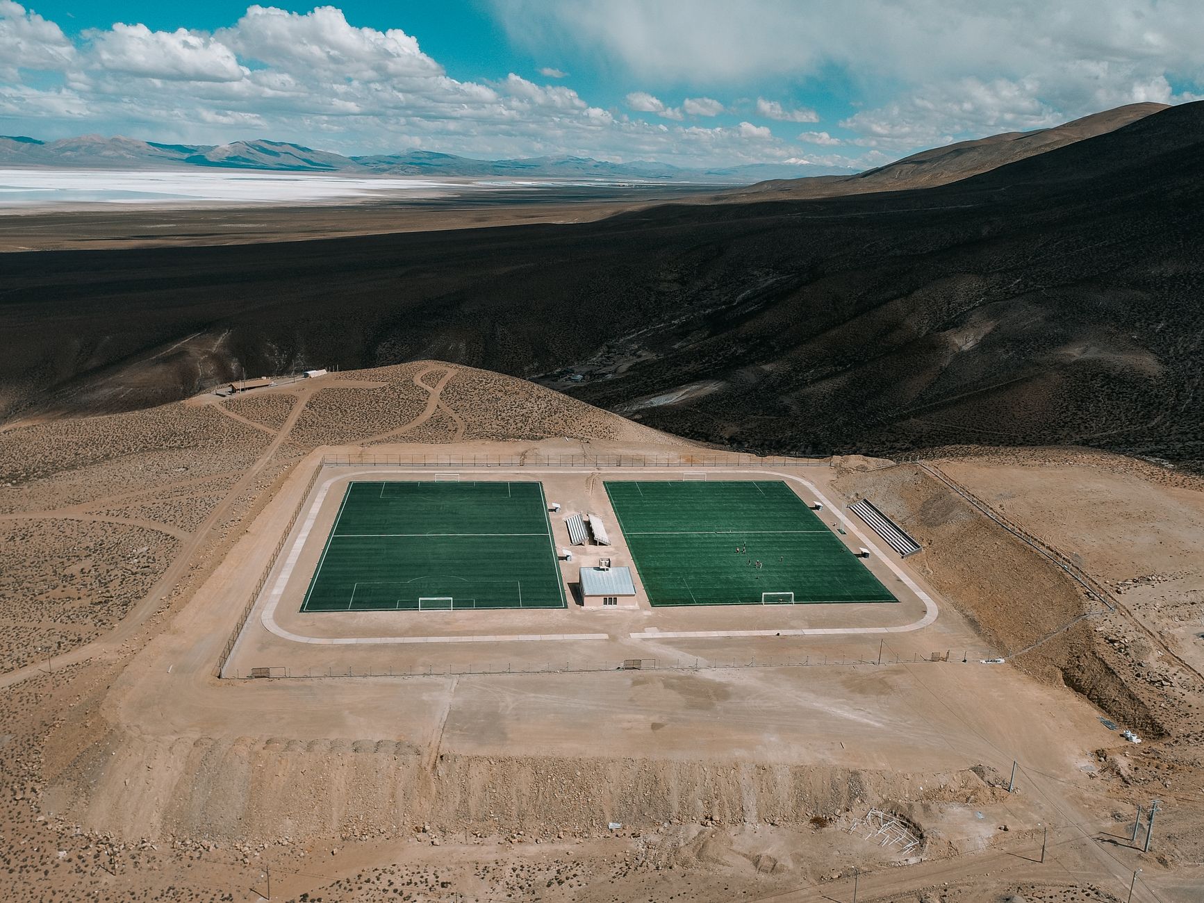 A striking aerial view of soccer fields in the remote desert landscape of Olaroz Chico, Jujuy, Argentina.