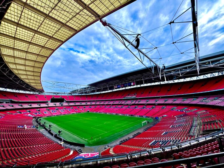 A stunning view of the iconic Wembley Stadium in London, capturing its vastness and architectural beauty.