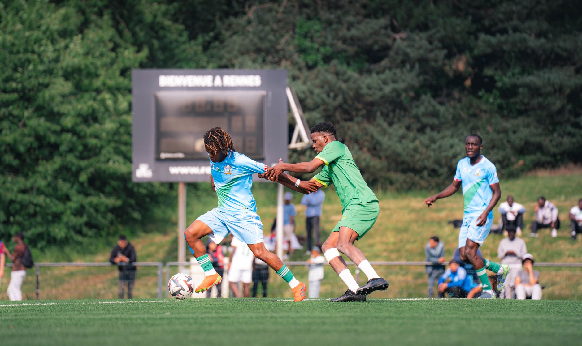 Players compete in a thrilling soccer match at Rennes, showcasing sportsmanship.