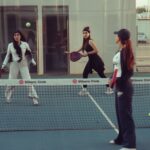 Women engaged in a padel tennis match at Vibora Club, Baghdad, Iraq.
