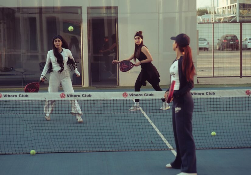 Women engaged in a padel tennis match at Vibora Club, Baghdad, Iraq.