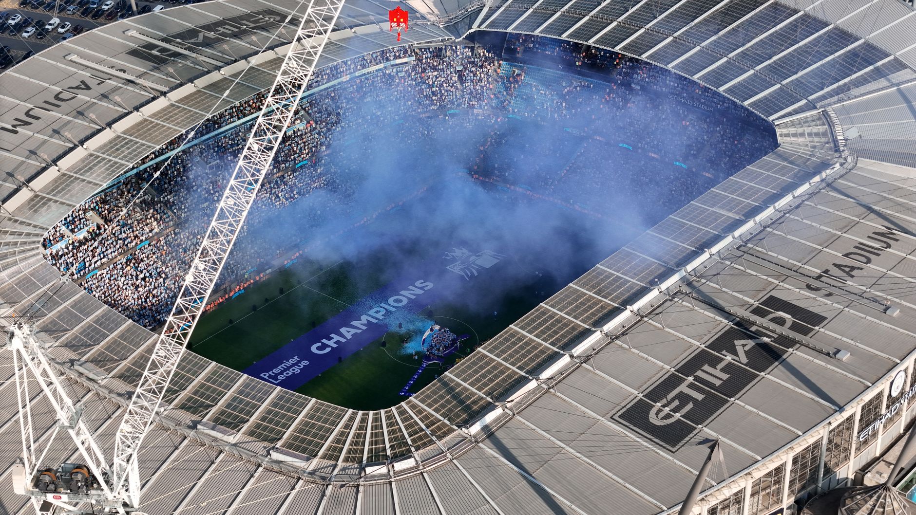 Aerial shot of Etihad Stadium during a soccer event in Manchester, UK.