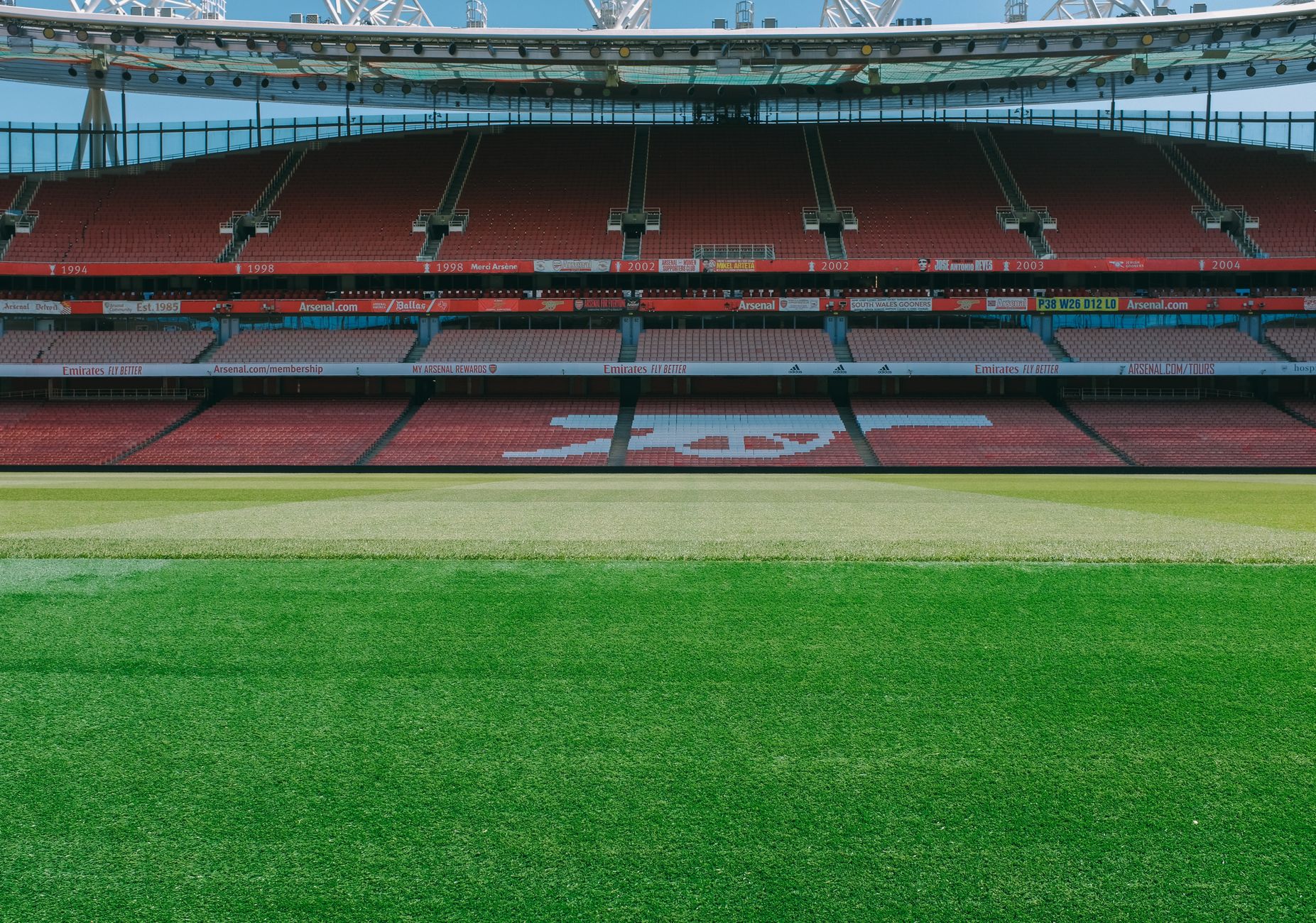 A view of the empty stands and football pitch at Emirates Stadium, London.