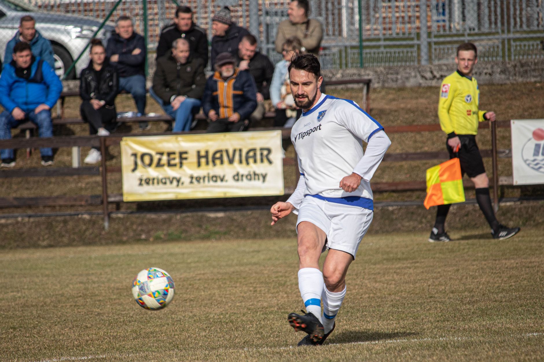 Soccer player in action during an amateur match in Domaniža, Slovakia.