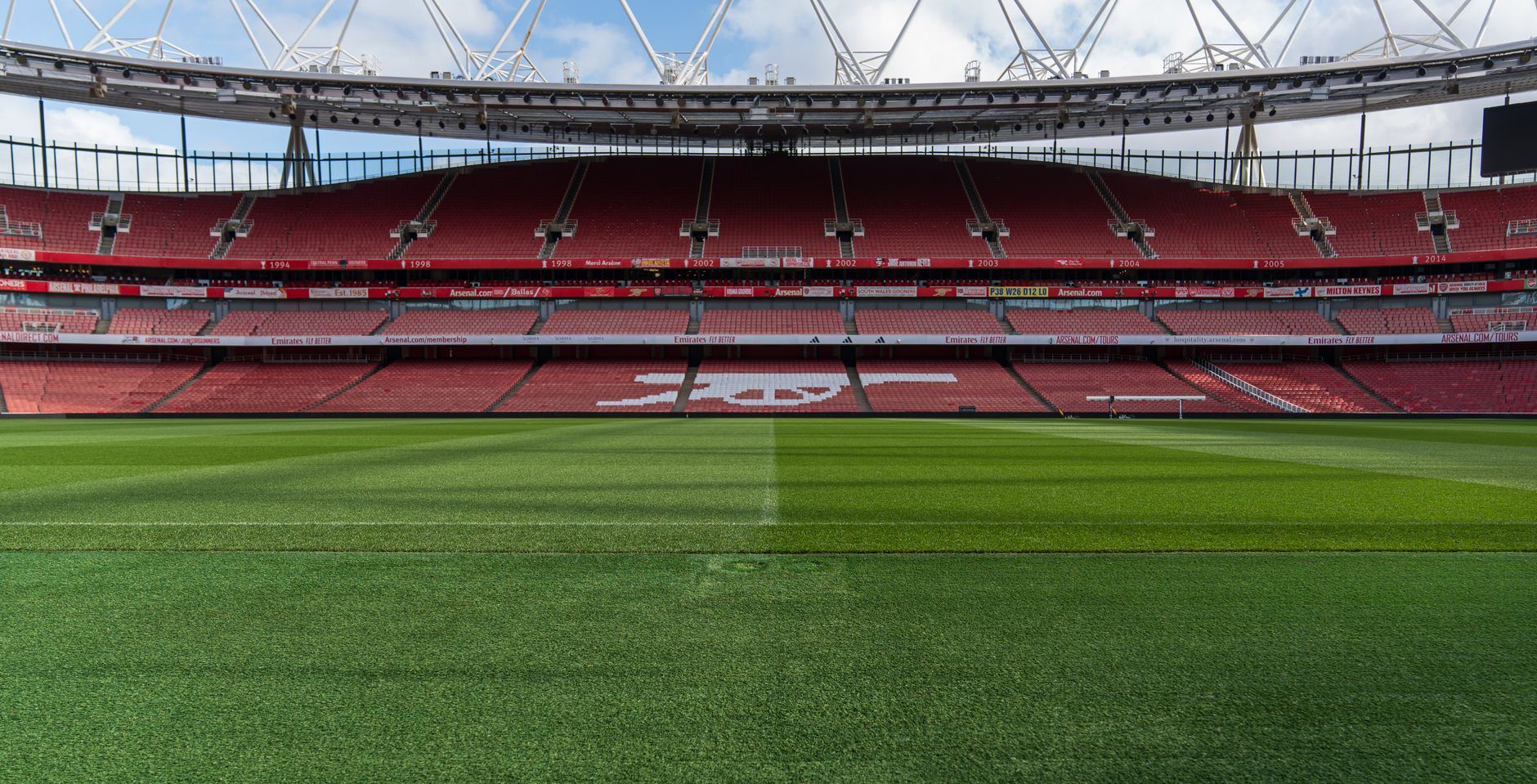 Wide view of an empty Emirates Stadium, home of Arsenal FC, in North London, England.
